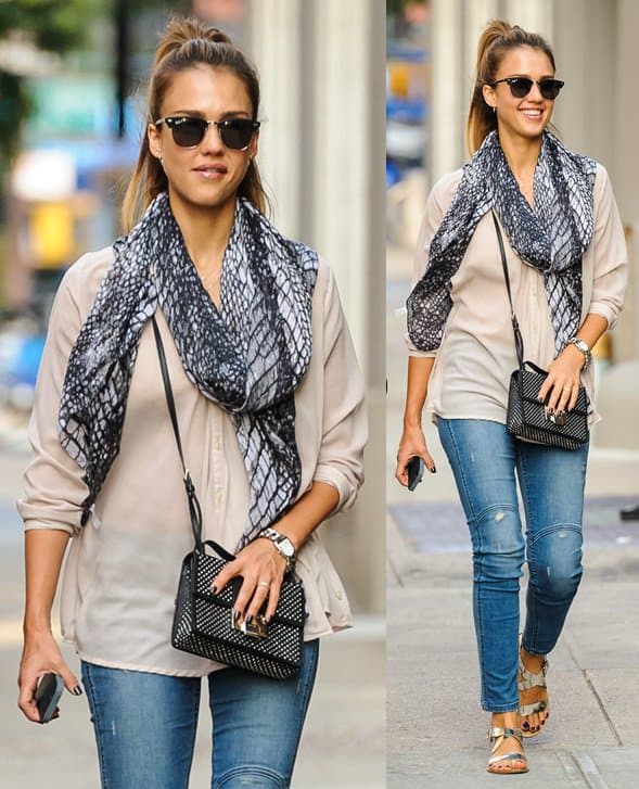 Jessica Alba was spotted in New York City on September 10, 2013, wearing a Spun by Subtle Luxury cobra scarf, Ray-Ban Clubmaster 3016 sunglasses, a Pong Rugged Apple iPhone 6 signal boosting case in black, Delman Maud flat sandals in silver, and a Jimmy Choo Rebel studded leather black crossbody bag