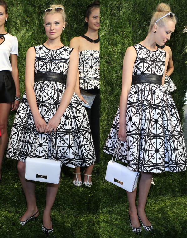 Kate Spade's black and white dress featuring a vintage-style fit and flare with an empire waist and intricate wrought iron gate print