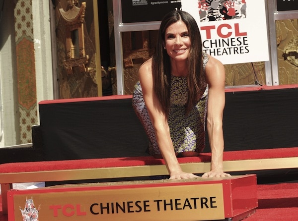 Sandra Bullock kept her dark tresses straight and tucked behind one ear