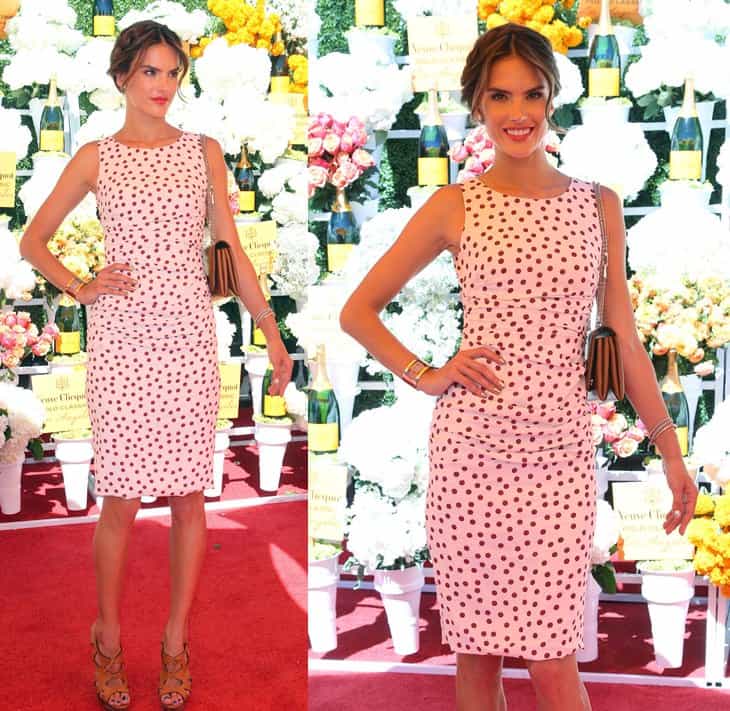 Alessandra Ambrosio wearing a Dolce Gabbana polka-dot ruched dress, Christian Louboutin Fossile sandals, and a Valentino Va Va Voom studded clutch