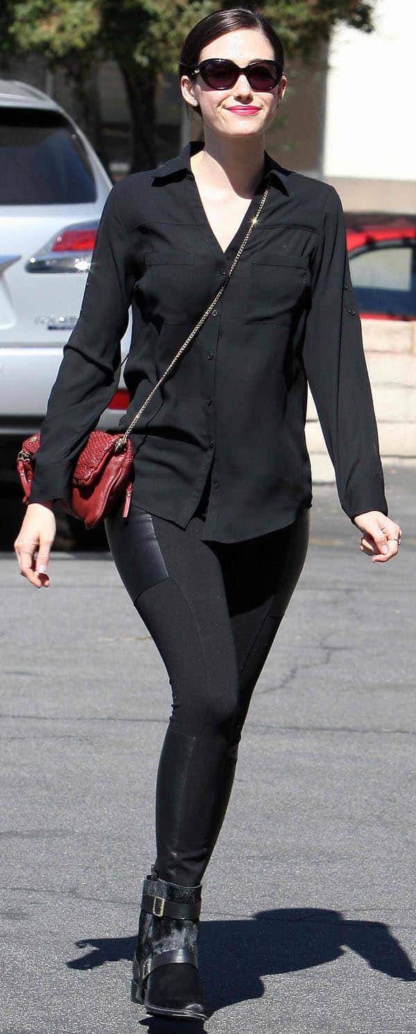 On October 8, 2013, Emmy Rossum was spotted in Los Angeles wearing Twenty Tees ponte leggings with leather patches in black, a Zadig Voltaire Rock Tresse pochette, and Rachel Zoe Terri booties
