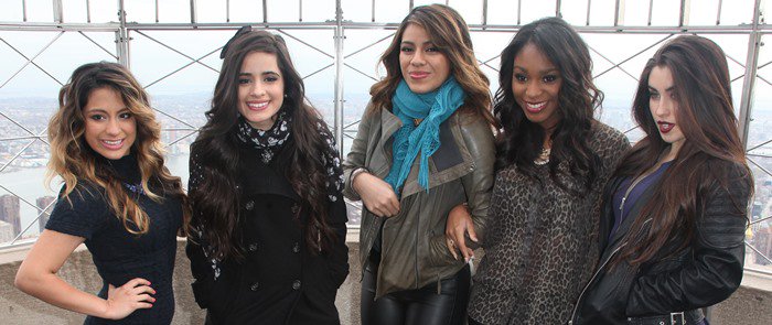 Ally Brooke, Camila Cabello, Dinah Hansen, Normani Hamilton, and Lauren Jauregui of Fifth Harmony pose at the Empire State Building for a promotional event