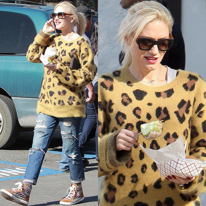 Gwen Stefani brings effortless cool to the German Festival in San Bernardino, pairing a Chloë Sevigny for Opening Ceremony leopard-print sweater with Paige “Willa Destructed” jeans, Tory Burch “Noah” high-top sneakers, and Quay tortoiseshell sunglasses