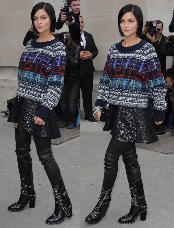 Leigh Lezark embraces fall in a cozy Chanel sweater and bold chain-detailed thigh-high boots at Chanel’s Spring 2014 show