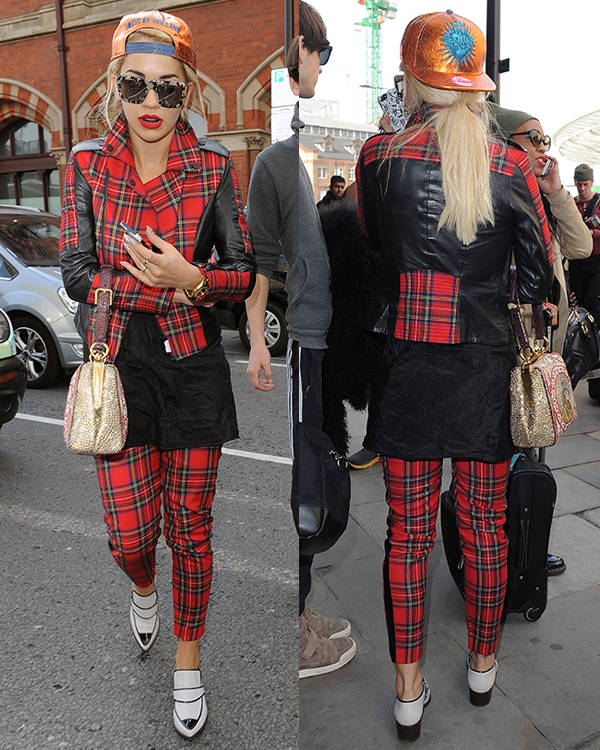 Rita Ora was spotted returning to London via Eurostar on October 2, 2013, wearing a Karl Lagerfeld Vicious leather-trimmed tartan wool biker jacket, Karl Lagerfeld Macpherson tartan wool and faux leather pants, Chanel Fall 2013 calfskin short boots, and carrying a Dolce Gabbana Fall 2013 purse