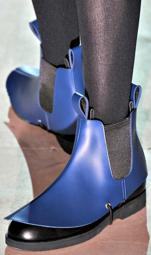 Bold blue Chelsea boots with a pointed toe and sleek matte finish featuring elastic side panels for a modern avant-garde twist