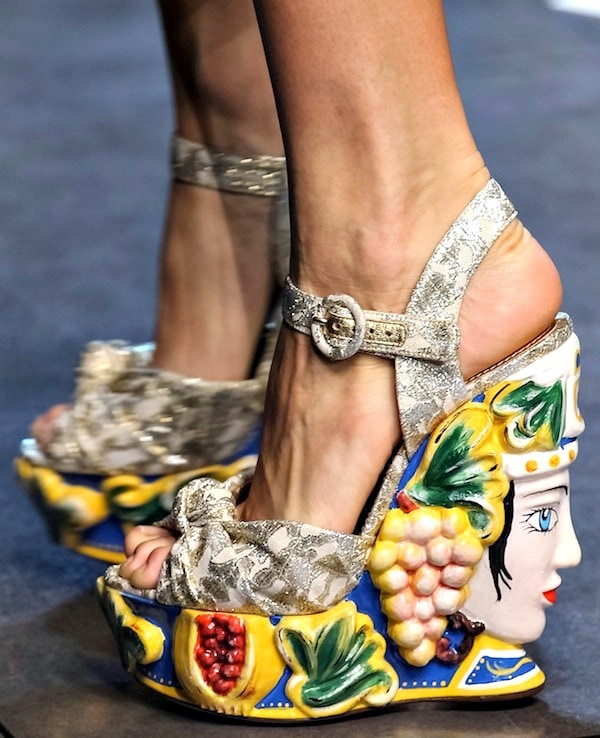 Dolce Gabbana wedge sandals with an intricate, colorful sculpted platform featuring a face and fruit motifs