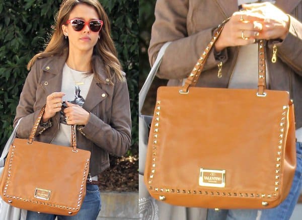 Jessica Alba's Valentino "Rockstud" bag adds a touch of luxury to her streetwear-inspired ensemble