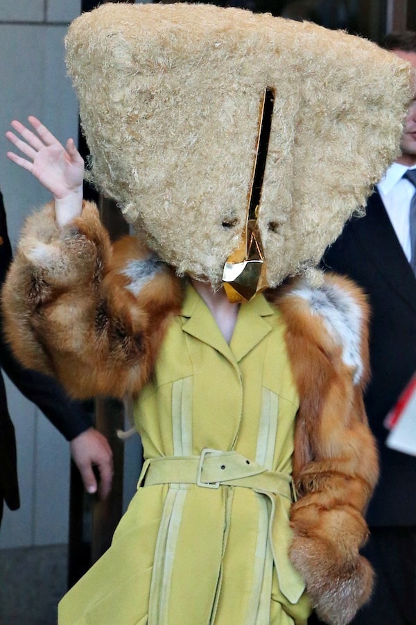 Lady Gaga's gigantic fur-covered headpiece, featuring a gold beak and eyeholes, from Charlie Le Mindu's haute couture Fall/Winter 2013 collection