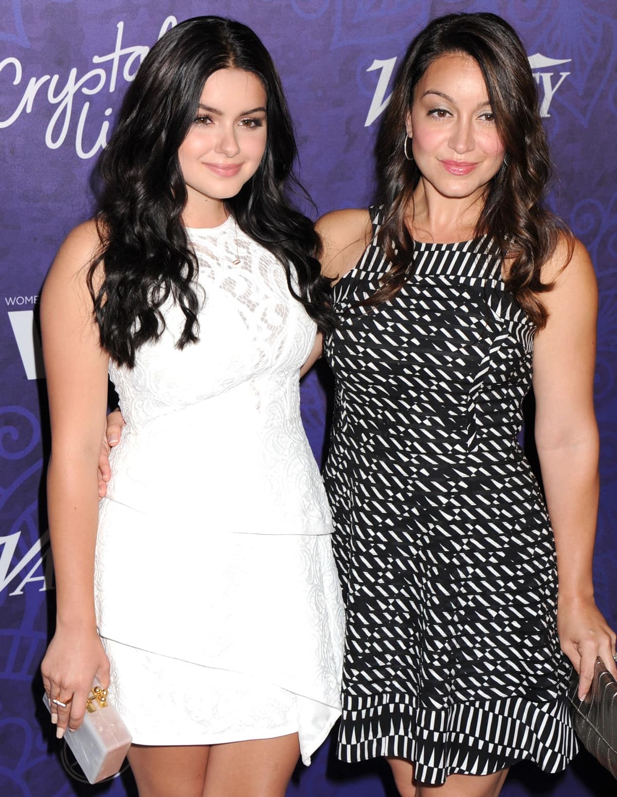 Ariel Winter, in a sleeveless white lace dress paired with a clear acrylic clutch, attends an industry event with her sister Shanelle Gray in Los Angeles