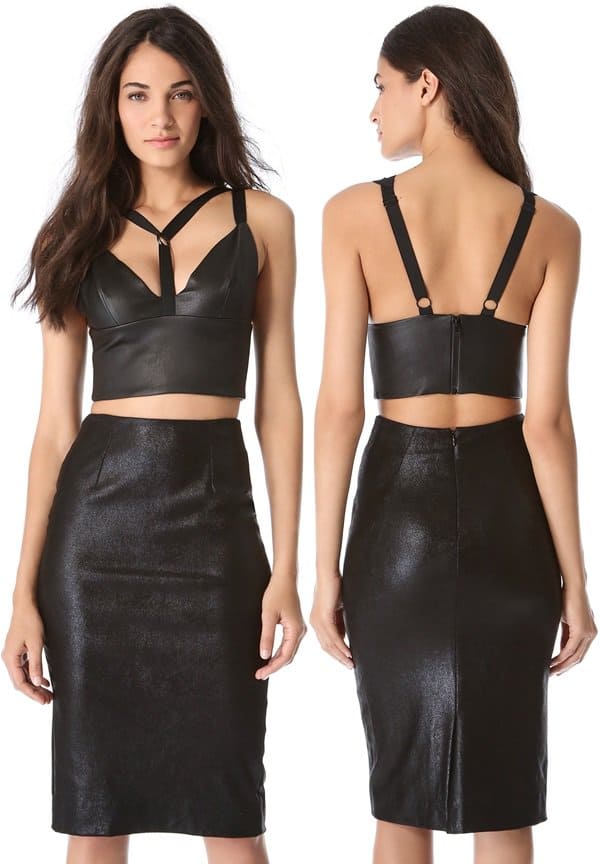 A sleek Cushnie et Ochs leather crop top and matching pencil skirt showcase the brand’s signature balance of structured minimalism and subtle edge, with harness-style straps adding modern tension