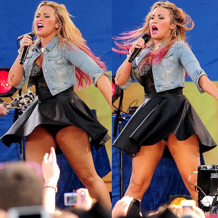 Demi Lovato rocks the stage in a flared leather skirt and studded denim jacket during her high-energy performance on Good Morning America, even as the wind tries to steal the spotlight