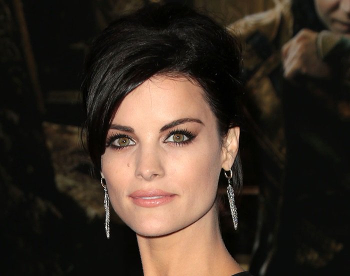 Jaimie Alexander's silver feather-shaped earrings