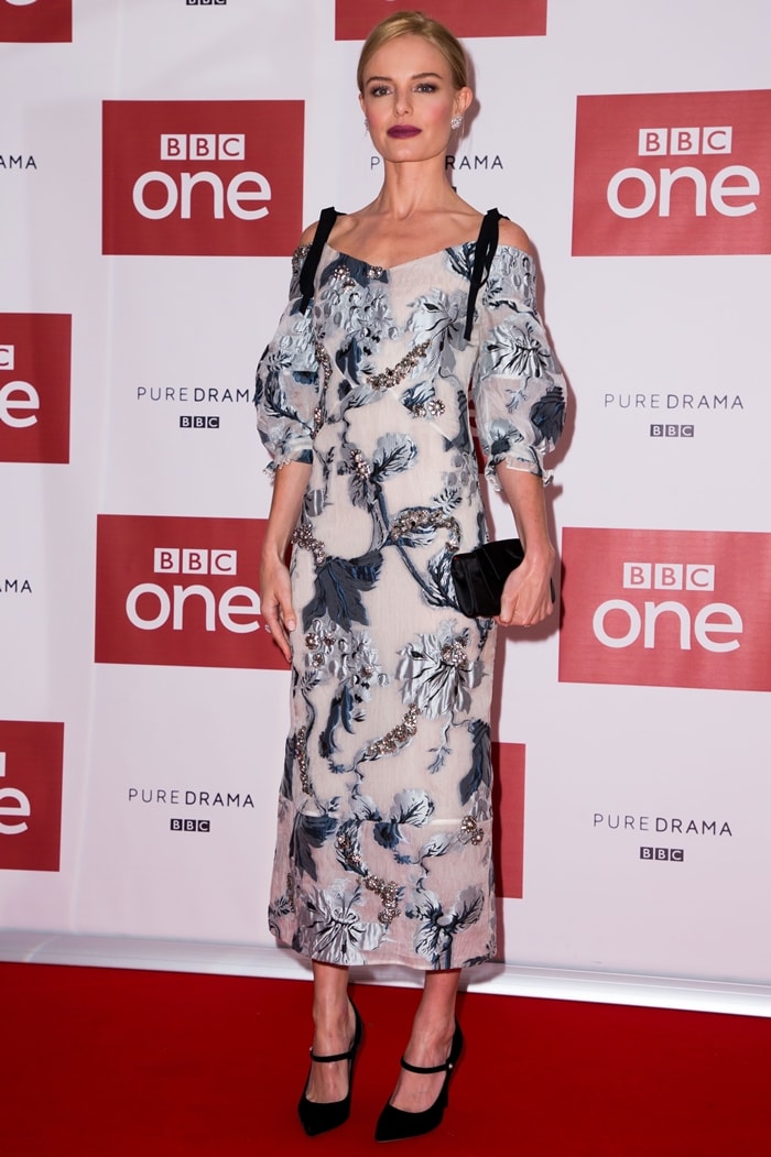 Kate Bosworth looked ethereal in a floral-embroidered, off-the-shoulder tea-length dress at the world premiere of BBC One’s SS-GB at the May Fair Hotel on January 30, 2017, in London, England, styling the look with classic black ankle-strap pumps and a sleek clutch