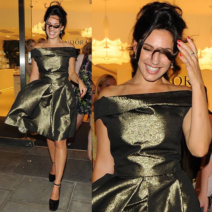Kelly Brook radiates elegance in a metallic off-shoulder dress as she laughs off a playful gust of wind at the Pandora Oxford Street store launch partyKelly Brook radiates elegance in a metallic off-shoulder dress as she laughs off a playful gust of wind at the Pandora Oxford Street store launch party