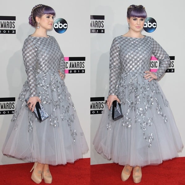 Kelly Osbourne arrived at the 2013 American Music Awards in a voluminous silver-gray Rami Al Ali gown paired with nude Aldo platform pumps, balancing the dress’s dramatic tulle skirt and reflective embellishments with sleek, height-boosting footwear