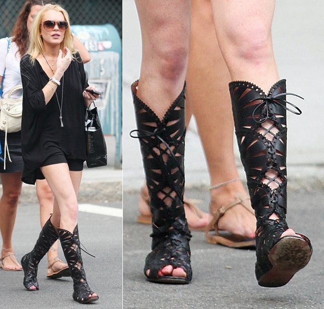 Lindsay Lohan stuns in a little black dress with knee-high Azzedine Alaïa lace-up gladiator boots in SoHo, August 19, 2009