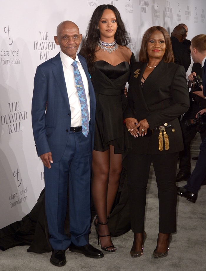 Rihanna, her grandfather Lionel Braithwaite, and her mother Monica Braithwaite at the Diamond Ball in New York City