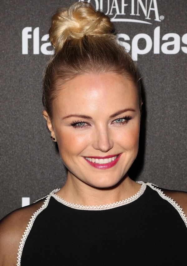 Malin Akerman's magenta lip and chic top-knot hairstyle