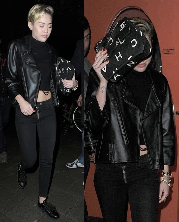 Miley Cyrus steps out in Amsterdam wearing a sleek black leather jacket, cropped turtleneck sweater, skinny jeans, platform lace-up shoes, and a bold Chanel vintage printed bag