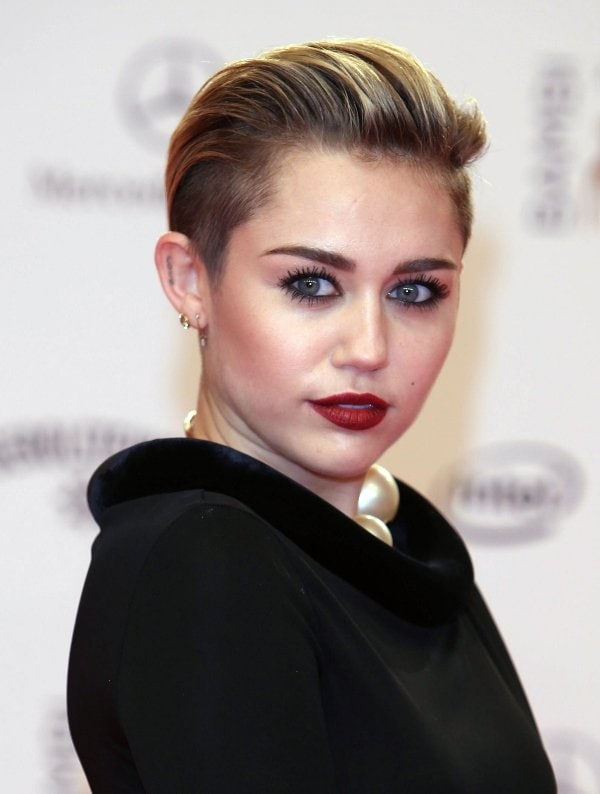 Miley Cyrus stuns with a sleek hairstyle and bold makeup at the Bambi Awards