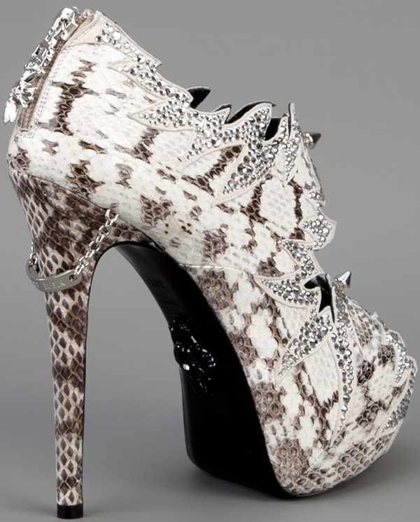 The attention to detail on the back of the shoe, such as the ID chain tag and the charm on the back ankle zipper, is remarkable
