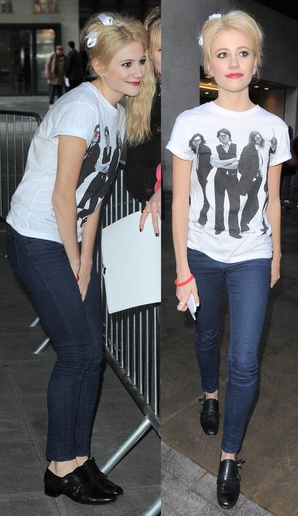 Pixie Lott arrives at the BBC Radio 1 studios in London on January 31, 2013, wearing a graphic t-shirt, dark skinny jeans, and black loafers, with her blonde hair styled in two playful top knots adorned with white bows