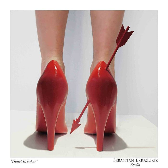 The ‘Heart Breaker’ stilettos, inspired by Laura, pierce with a scarlet arrow through glossy red heels—an unapologetic symbol of passion, pain, and the sharp sting of love lost
