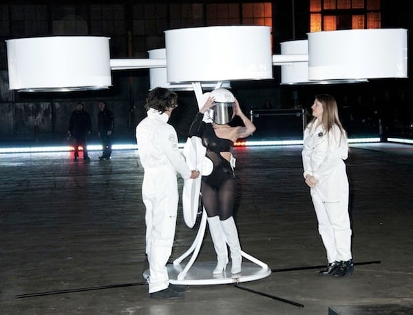 Lady Gaga places a helmet on her head as she prepares to fly her "Volantis" dress