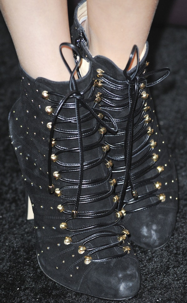 Bella Thorne in black lace-up booties