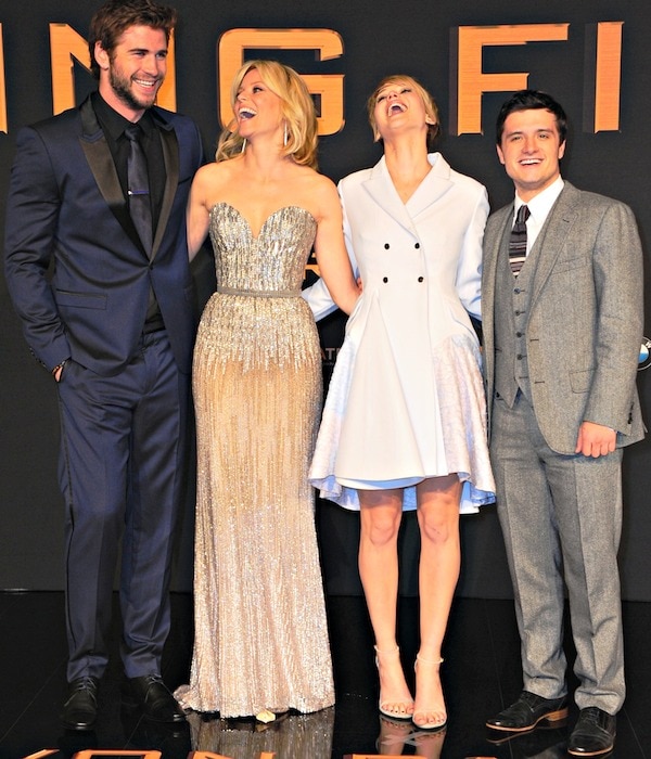 Liam Hemsworth, Elizabeth Banks, Jennifer Lawrence, and Josh Hutcherson pose for photos