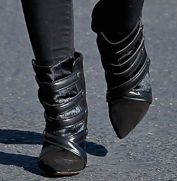 Hilary Duff's Isabel Marant "Tacy" boots, featuring edgy leather straps and a sleek pointed toe, are popular for their bold design that effortlessly elevates any casual outfit
