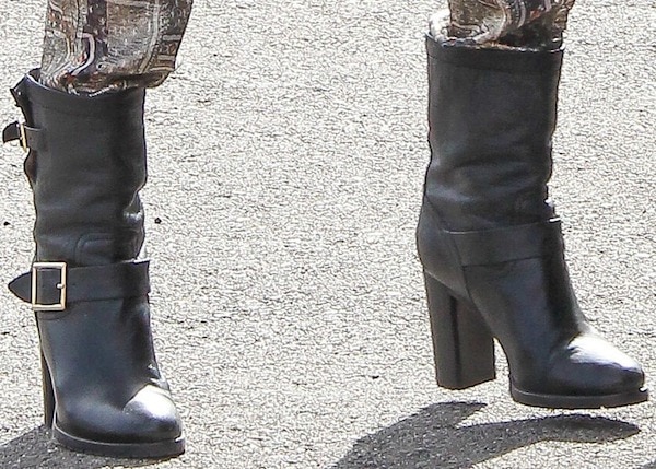 Completing the outfit, Jessica Alba steps out in black Jimmy Choo “Dart” biker boots with chunky heels and gold buckles