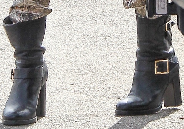 Completing the outfit, Jessica Alba steps out in black Jimmy Choo “Dart” biker boots with chunky heels and gold buckles