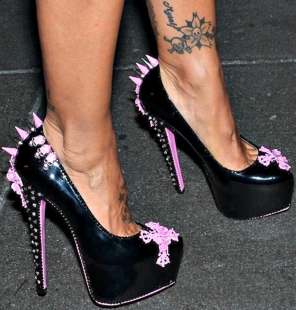 Jodie Marsh wore striking black platform pumps adorned with pink skulls, studs, and spikes, turning her footwear into a gothic-glam statement piece