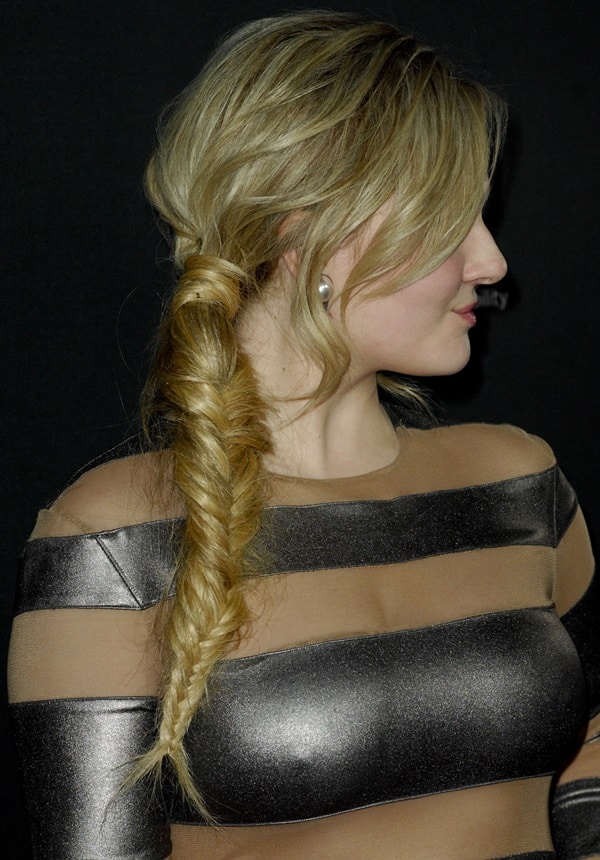 Abigail Breslin highlights her look with a stylish fishtail braid and pearl earrings
