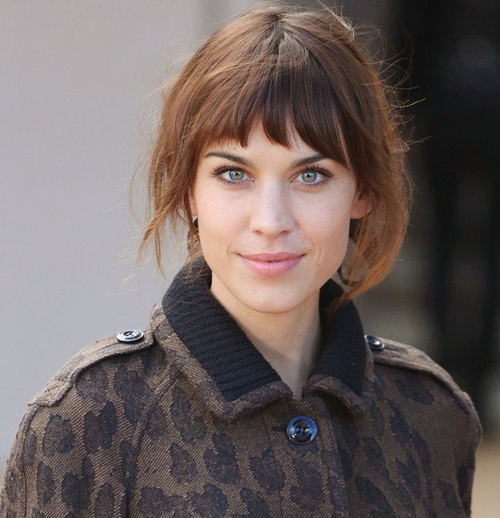 Alexa Chung arriving at the Burberry Prorsum spring/summer 2014 fashion show during London Fashion Week in London, England, on September 16, 2013