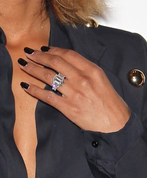 Ciara's breathtaking 15-carat emerald-cut diamond engagement ring is a true showstopper, perfectly complemented by her bold black manicure