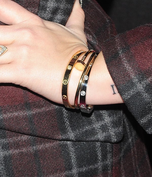 Demi Lovato accessorizes her look with elegant Cartier Love bracelets in pink gold and diamonds