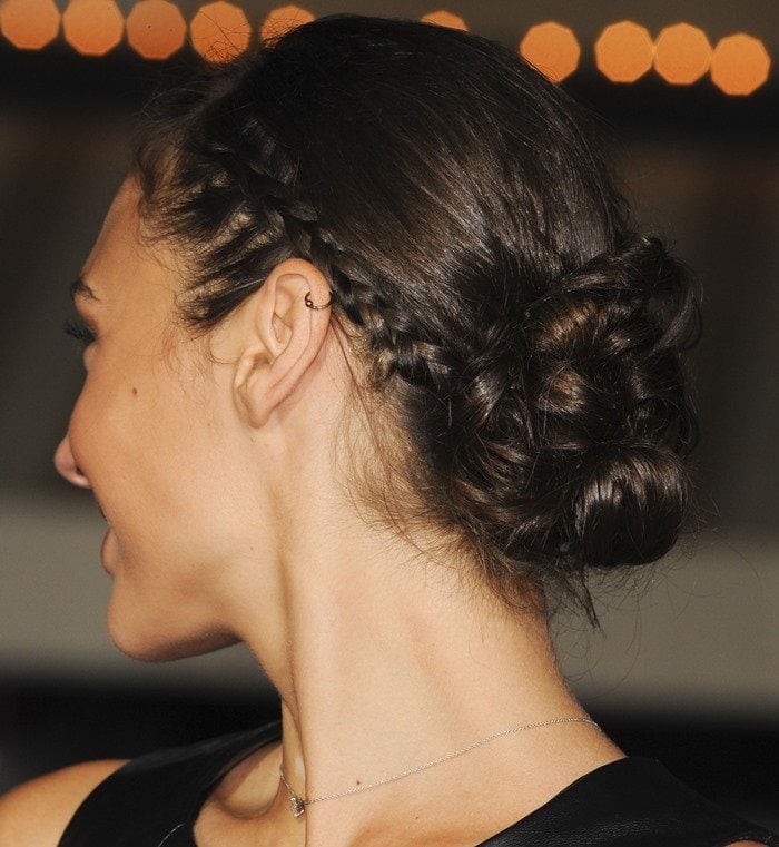 Gal Gadot showcases an intricate braided updo, perfectly complementing her elegant and polished look