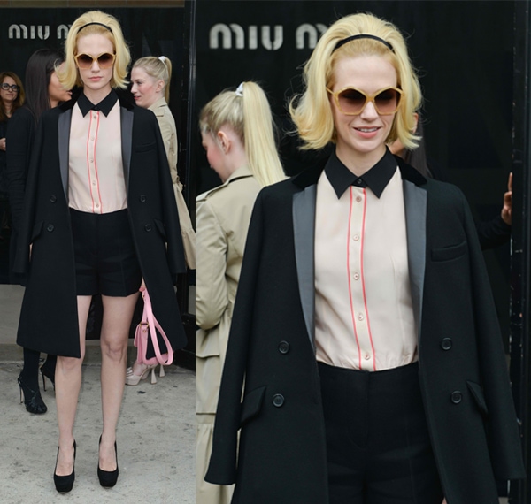 January Jones wore a long trench coat over her shoulders at the Miu Miu runway show