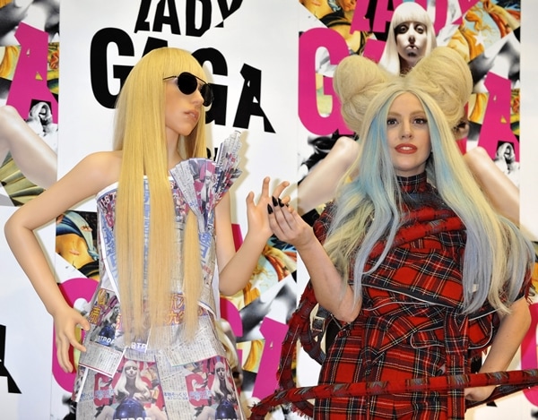 Lady Gaga poses with a life-sized Gagadoll dressed in one of her iconic looks at the Artpop press conference in Tokyo