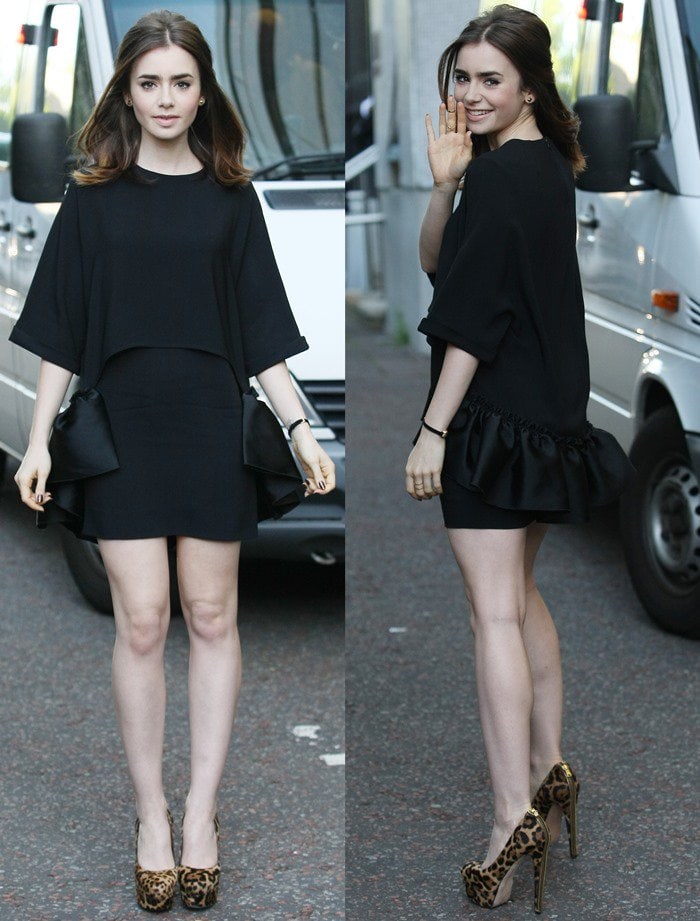 Lily Collins lets her leopard-print Brian Atwood platform pumps take the spotlight against the clean lines of her structured black dress