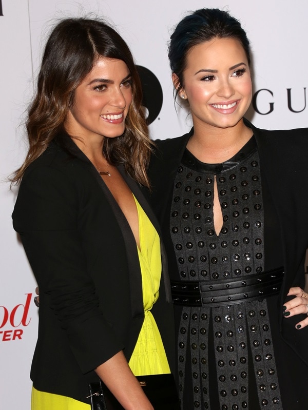 Demi Lovato and Nikki Reed Demi Lovato appears taller than Nikki Reed due to her high heels, despite being shorter in height