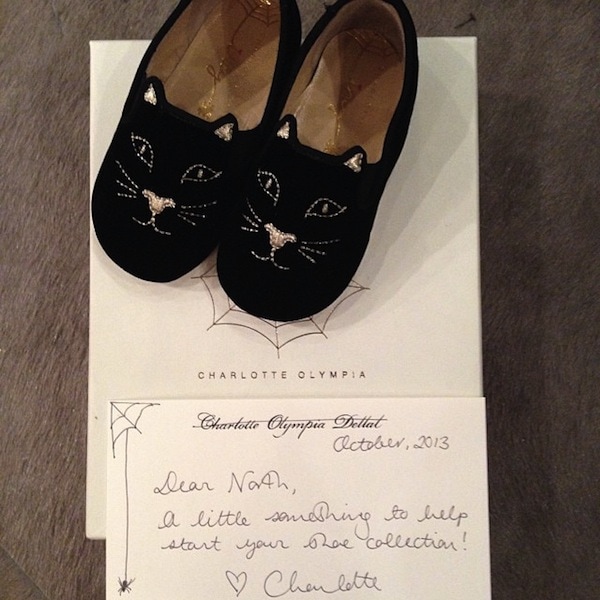 North West receives her first pair of Charlotte Olympia kitty flats, complete with a handwritten note from the designer herself, welcoming her to the world of high fashion