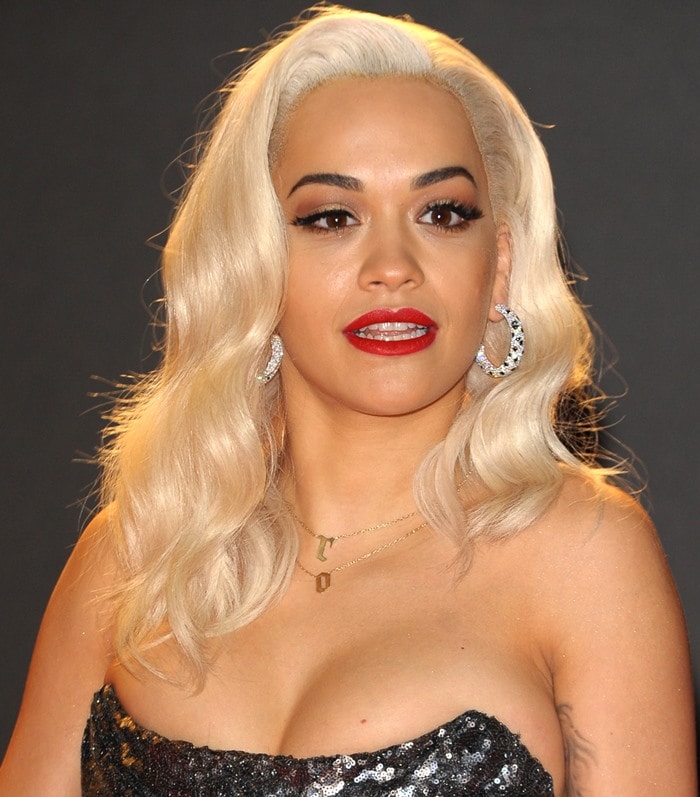 Rita Ora wears her blonde hair in soft curls at the 2013 British Fashion Awards