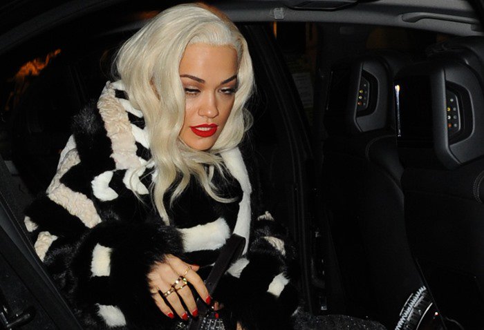 Rita Ora slips into a plush Tom Ford Fall 2013 fur coat, its bold black-and-ivory pattern setting the tone for her high-fashion after-party entrance
