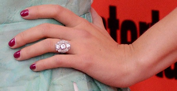 Scarlett Johansson's exquisite art deco engagement ring reveals its intricate design, featuring three round-cut diamonds set in a unique, geometric arrangement