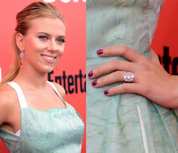 Scarlett Johansson showcases her stunning art deco engagement ring, featuring three round-cut diamonds set vertically on a geometric base, perfectly complementing her elegant style