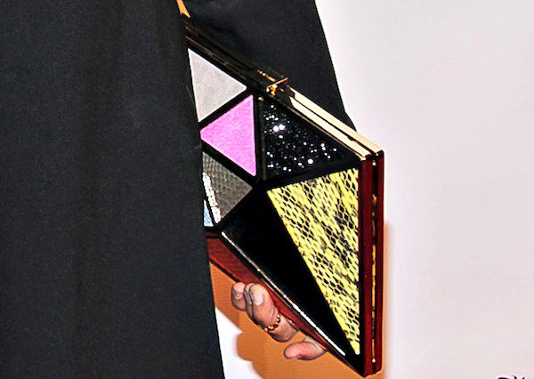 Rashida Jones added a bold pop of color to her look with a geometric "Cairo" clutch from Jimmy Choo’s Spring 2014 collection